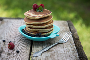 Delicious pancakes close up, with fresh berries