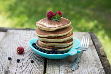 Delicious pancakes close up, with fresh berries