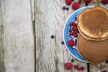 Delicious pancakes close up, with fresh berries