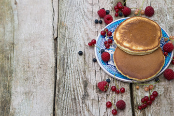 Delicious pancakes close up, with fresh berries