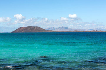 Fototapeta premium View of Lobos island from Beach in Corralejo, Fuerteventura, Canary Islands, Spain