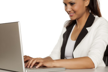 beautiful business woman working on her laptop