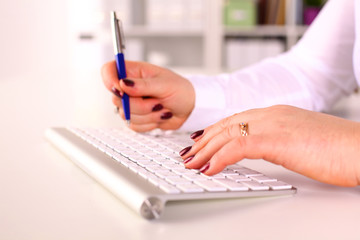 Fototapeta premium Young businesswoman working on a laptop