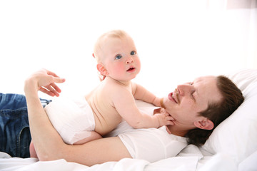 Young father having fun with his little son