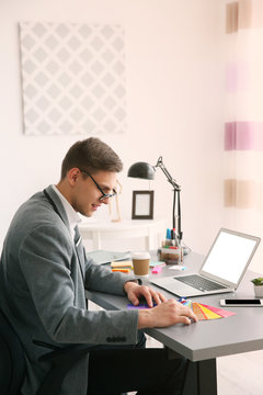 Man working with color samples at office