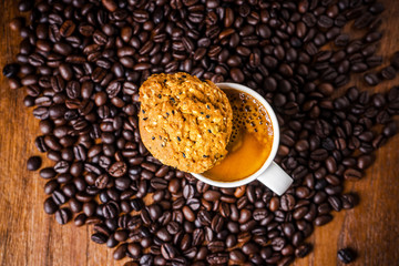 Cup of coffee with whole grains cookies