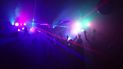 Young people dancing in night club