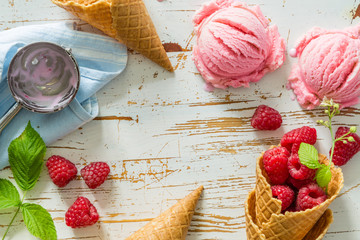 Raspberry ice cream on white wood background