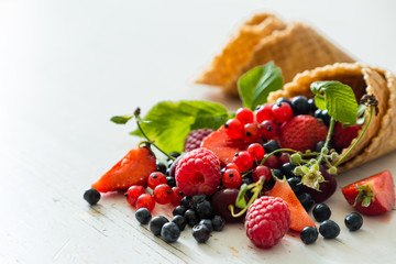 Selection of fresh berries in waffle cones