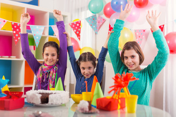 Group of adorable kids having fun at birthday party