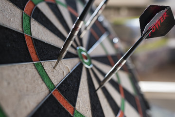 Darts sticking in a dartboard
