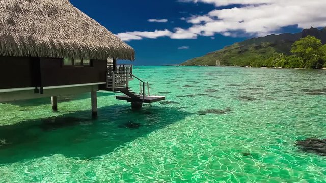 Over water bungalow with steps into amazing lagoon