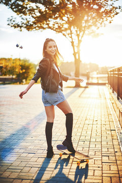 speeding skateboarding woman at city