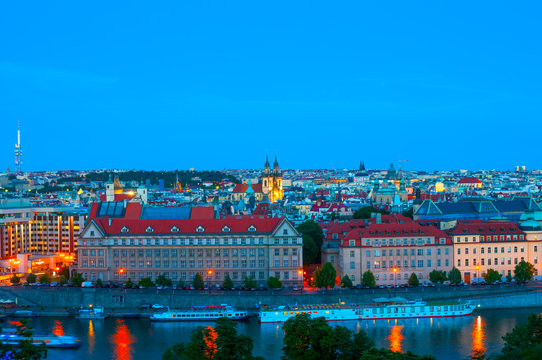 Top view on Vltava river and Prague cityscape at night