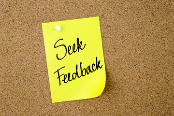 Seek Feedback written on yellow paper note