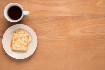 Mobile phone, notebook, pencil, coffee, tea, food cracker