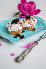 Breakfast of sandwiches with cheese and jam from blueberries.