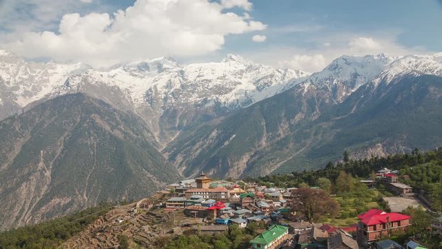 Time Lapse. Picturesque view of Kalpa village (2960 m) and Kinnaur Kailash sacred peak (6050 m) at sunrise. Spiti valley, Himachal Pradesh, India.