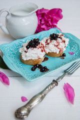 Breakfast of sandwiches with cheese and jam from blueberries.