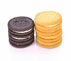 sandwich cookies with cream on white background