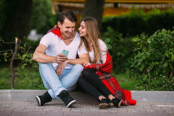 Beautiful young couple relaxing in the park