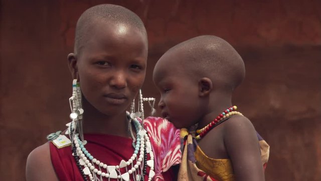 Portrait of young Masai woman and child in Tanzania