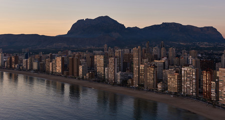 Aerial view of a Benidorm city coastline at sunset. Spain