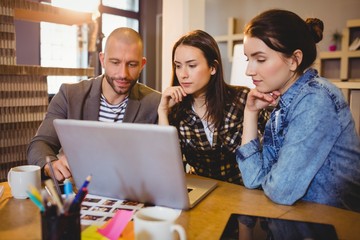 Team of graphic designer working on laptop