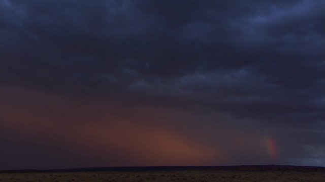 Sunset after desert storm, time lapse