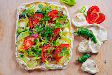 Cooking process of pie with vegetables on wooden background