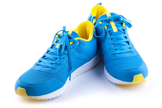 Pair of blue sport shoes on white background