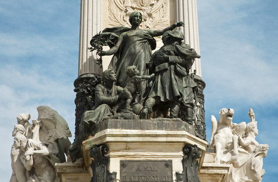 Madrid -   "La Paz" ("Peace") by Miquel Blay. Statue in the central base of the Monument of Alfonso XII in Buen Retiro park by architect Jose Grases Riera from year 1902 in March 9, 2013 in Spain.