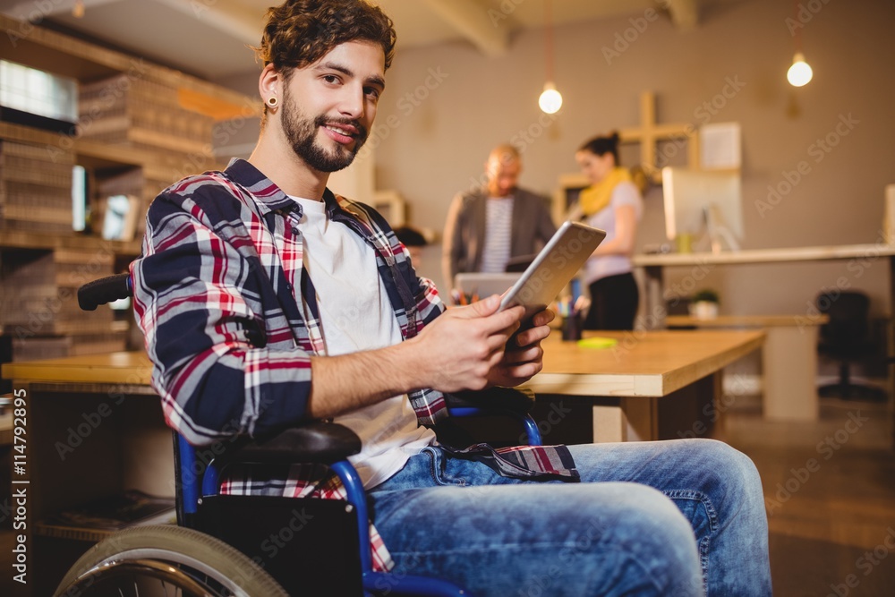 Poster graphic designer using digital tablet