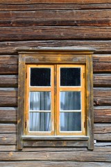 Window on log house