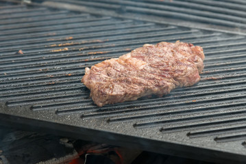 beef steaks on the grill