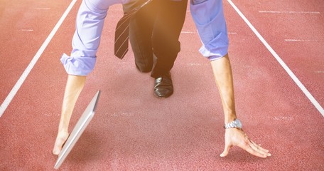 Composite image of businessman in the starting blocks