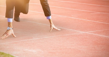 Composite image of businessman in the starting blocks