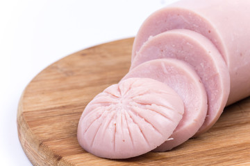 Sliced pork bologna salami on the wooden board © zlajaphoto