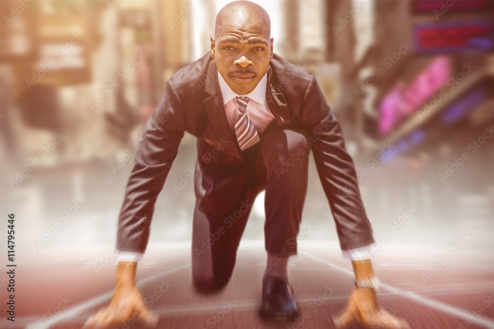 Poster composite image of close up of businessman in starting blocks