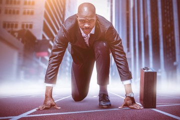 Composite image of businessman in the starting blocks