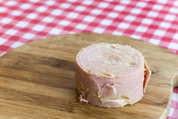 Luncheon meat on the wooden board