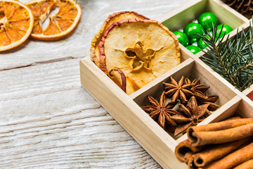 Christmas background with spices in a wooden box