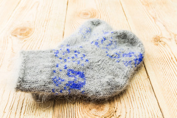 Fototapeta na wymiar Wool socks on old wooden background