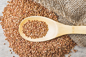 buckwheat groats and wooden spoon