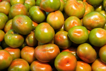 Colorful tomatoes as background. Close up