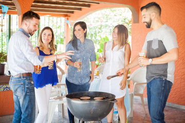 Friends grilling burgers and having a good time
