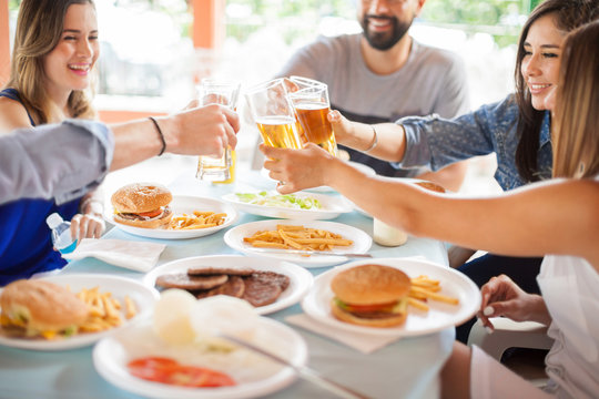 Group of friends with beer and burgers