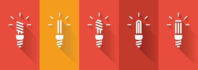 Fototapeta na wymiar Icons of energy saving lamp on reddish background