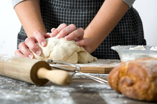Woman making bread with her hands

