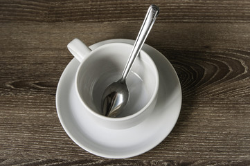 Cup of coffee on a wooden brown